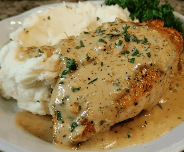 Delicious chicken topped with creamy Dijon sauce served alongside fluffy mashed potatoes, perfect for a comforting dinner.