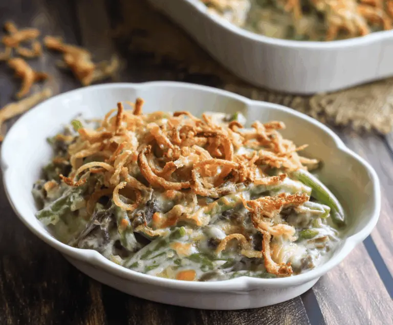 Delicious homemade Campbell's green bean casserole topped with crispy fried onions.