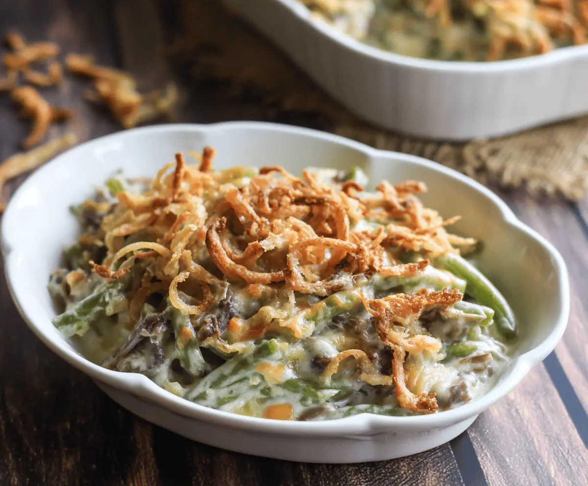 Delicious homemade Campbell's green bean casserole topped with crispy fried onions.