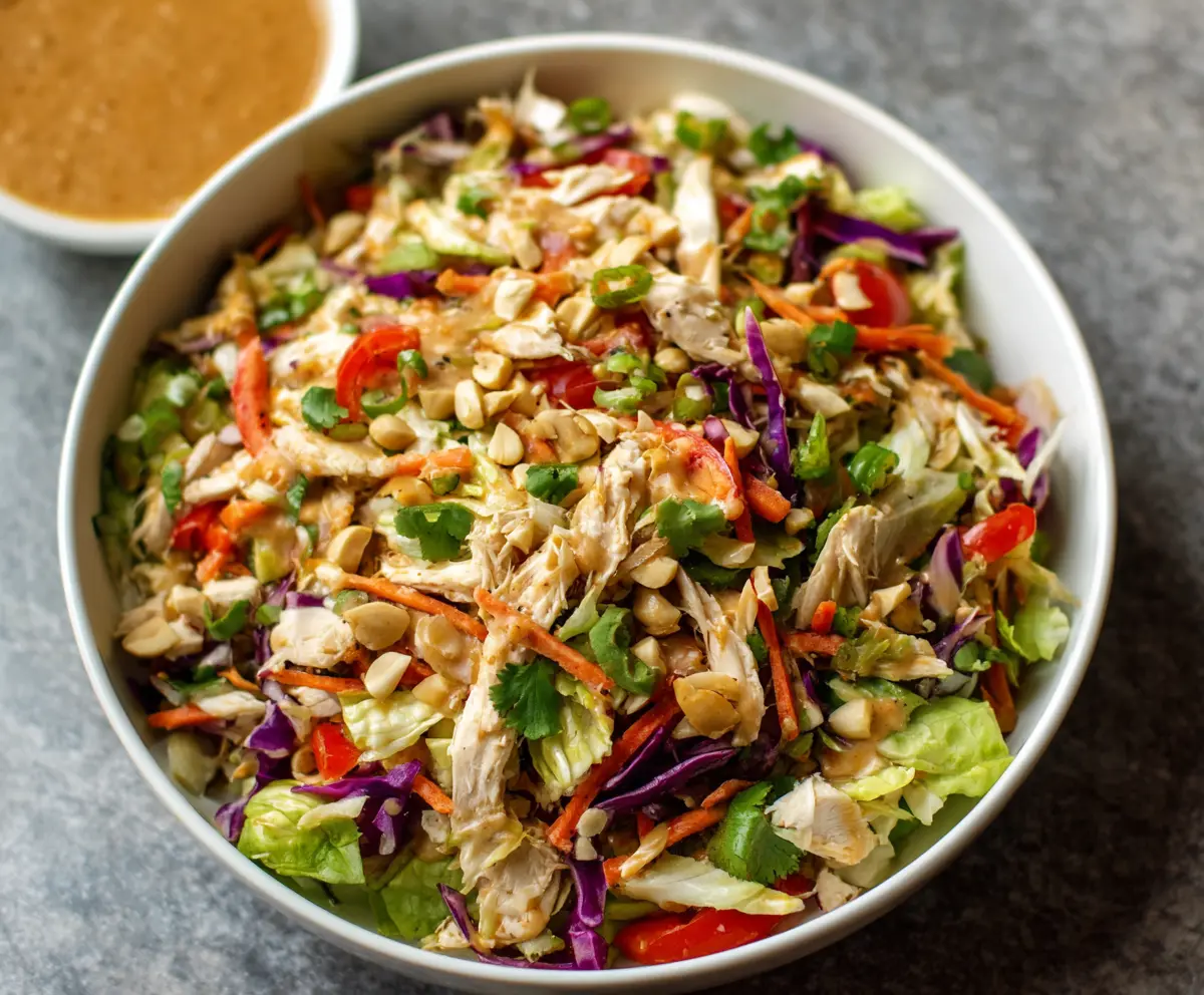 Colorful Thai Chicken Salad with Fresh Vegetables and Creamy Peanut Dressing