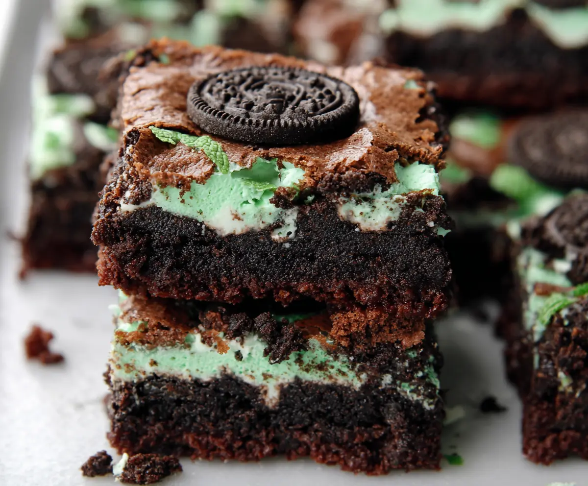 Delicious triple layer fudgy mint Oreo brownies with rich chocolate, mint, and Oreo cookie layers.