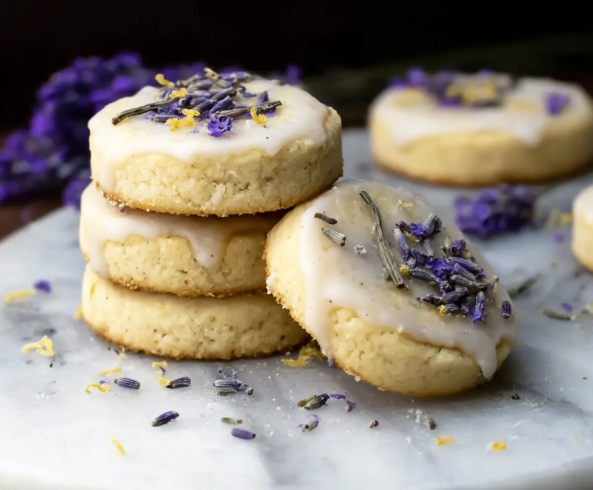 Decorative Lemon Lavender Shortbread Cookies on a serving plate, showcasing a citrus and floral flavor combination.