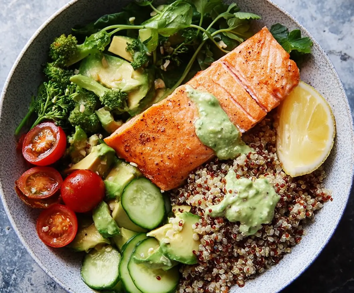 Healthy salmon and quinoa power bowl with fresh vegetables for a nutritious meal