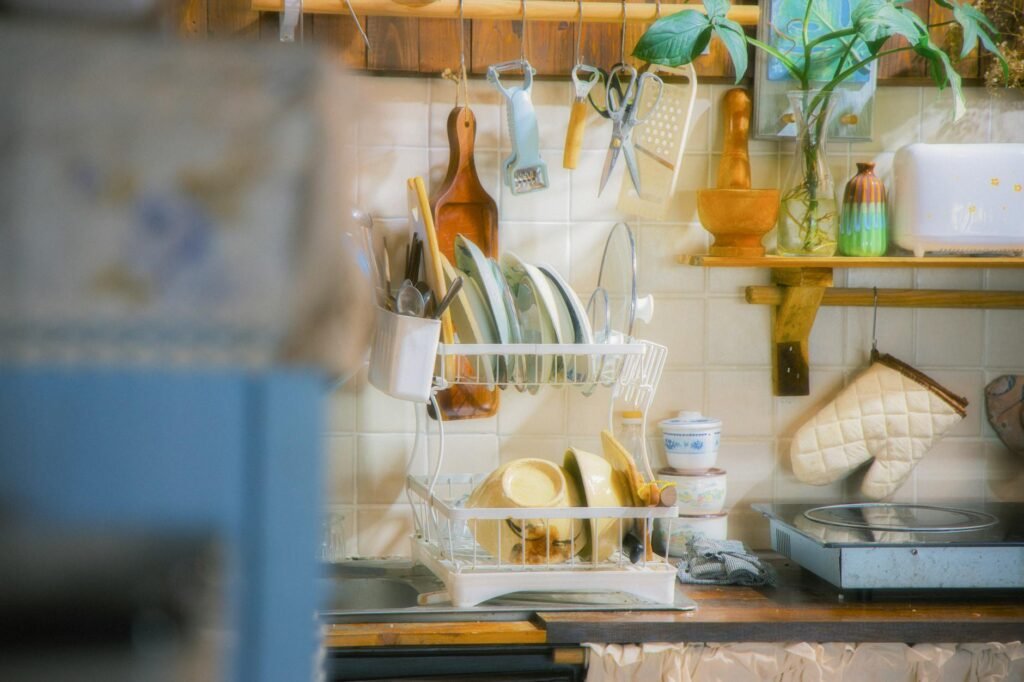 An oven thermometer hanging from the center rack of a home oven