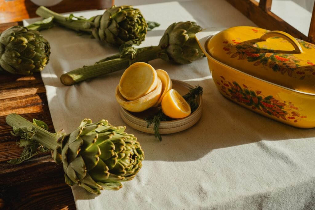 A casserole dinner set with lemon, herbs, and a fresh side salad