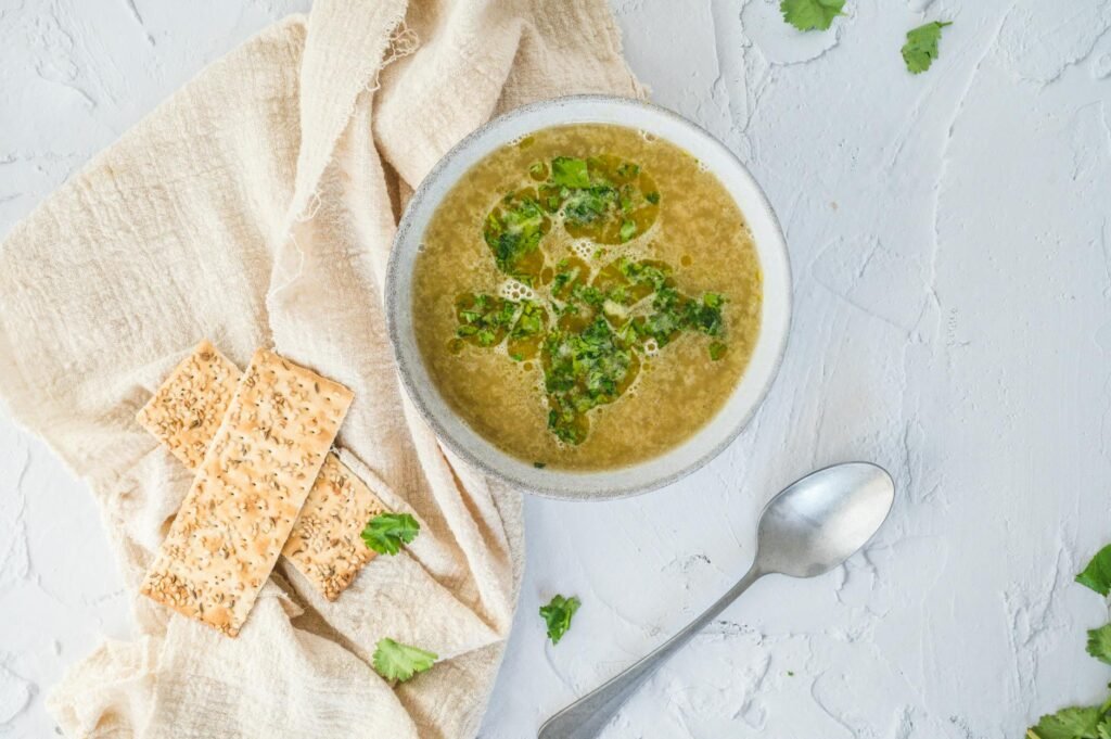 Small bowls of simple soup toppings next to a pot of soup.