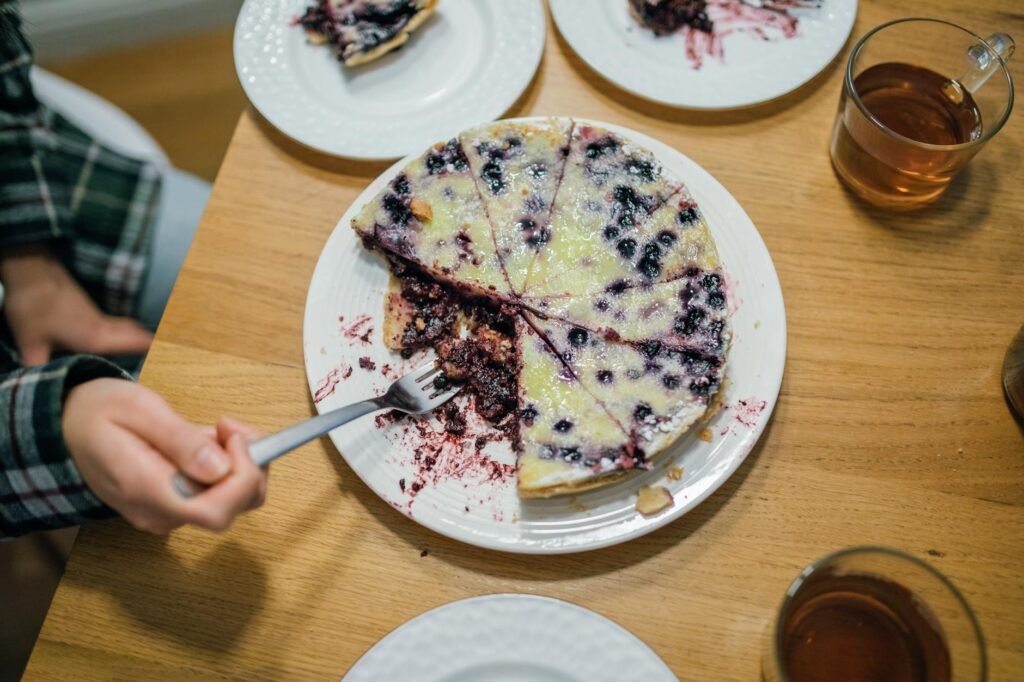 Finished berry tart sliced on a serving platter