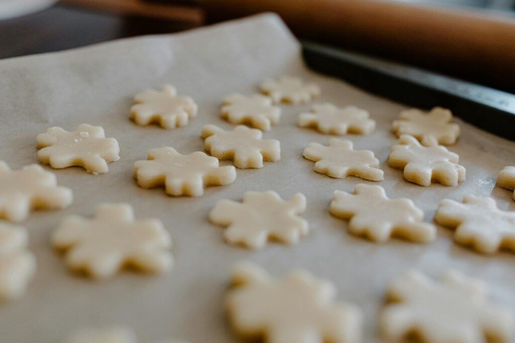 A baking sheet with flat over-spread cookies next to thicker evenly shaped cookies
