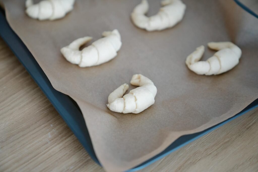 Unbaked berry puff-pastry tart on parchment with berry filling