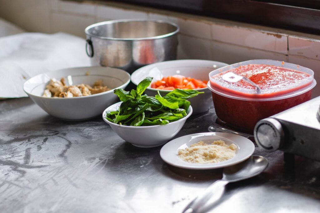 Small leftover ingredients arranged on a counter in separate bowls