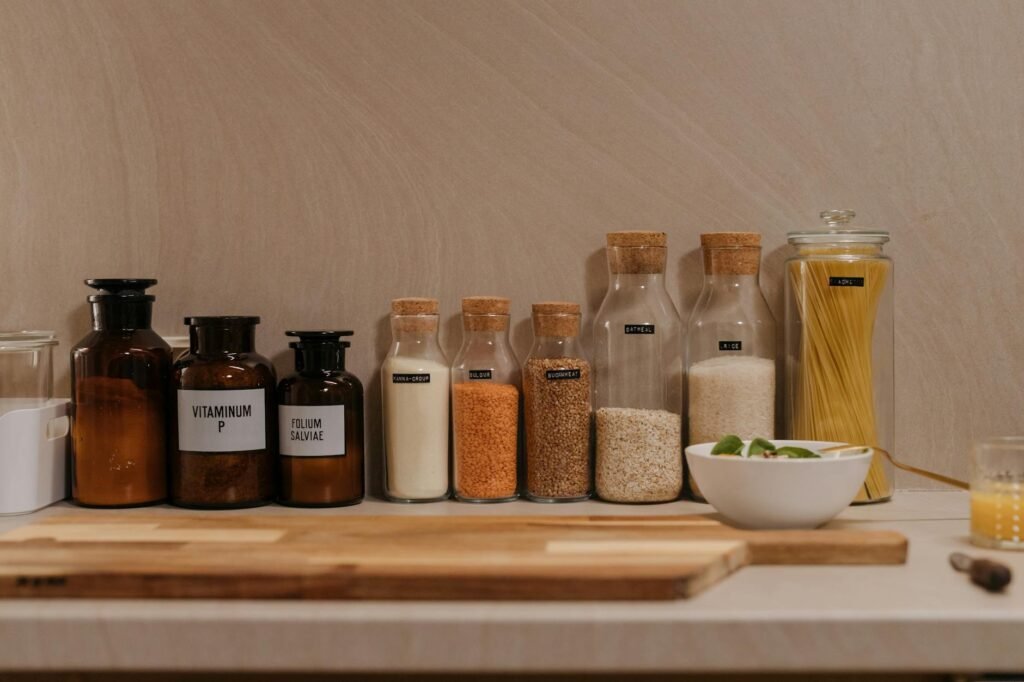 A refrigerator shelf with labeled leftovers and a bin for foods that need to be used soon.